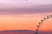 The sun sets in London behind the London Eye. One of Londons most loved tourist attractions, the London Eye can carry over 15,000 visitors per day.
